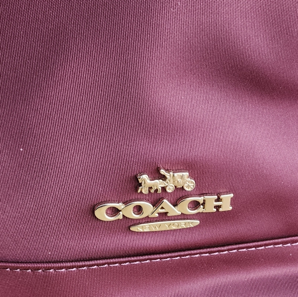Stylish Burgundy Coach Tote Bag with Red Straps